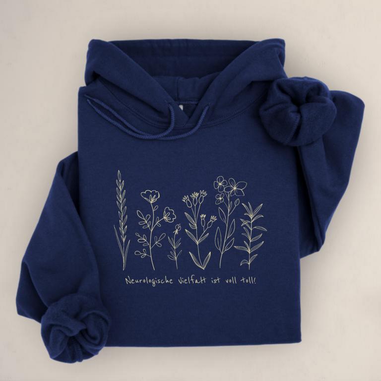 Gemütlicher Unisex aus Baumwolle Hoodie mit floraler Illustration und dem Schriftzug „Neurologische Vielfalt ist voll toll!“ – Statement für neurodivergente Sichtbarkeit.